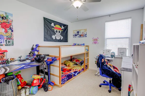 a play room with toys and a chandelier