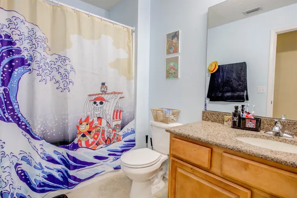 a bathroom with a sink toilet and vanity