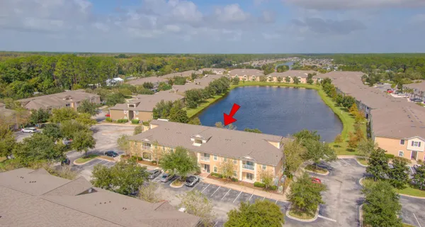 an aerial view of residential building and ocean