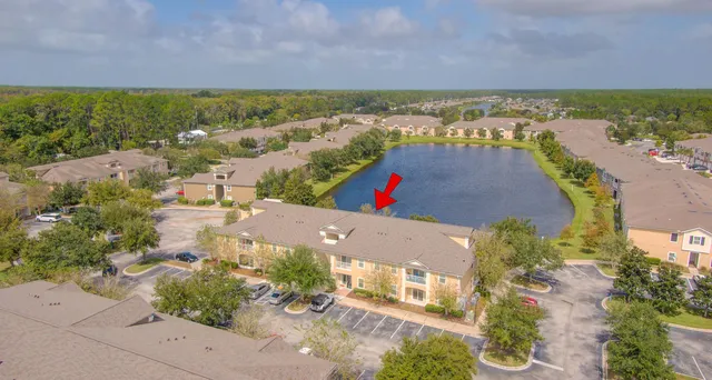 an aerial view of residential building and ocean