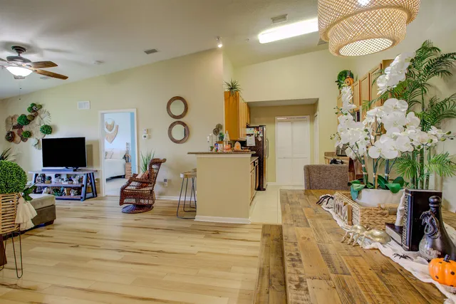 a living room with furniture and a flat screen tv