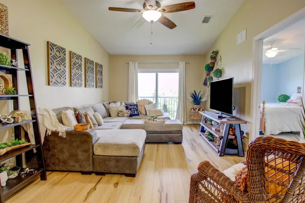 a living room with furniture and a flat screen tv