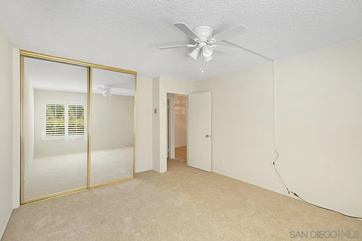 5906 Rancho Mission Road, Unit 5 San Diego, CA 92108 - Photo 16 of 33 a view of an empty room with a fan