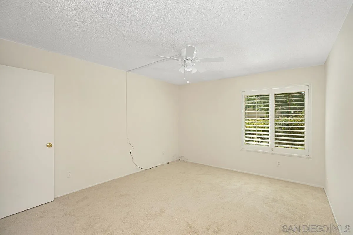 5906 Rancho Mission Road, Unit 5 San Diego, CA 92108 - Photo 17 of 33 an empty room with a window