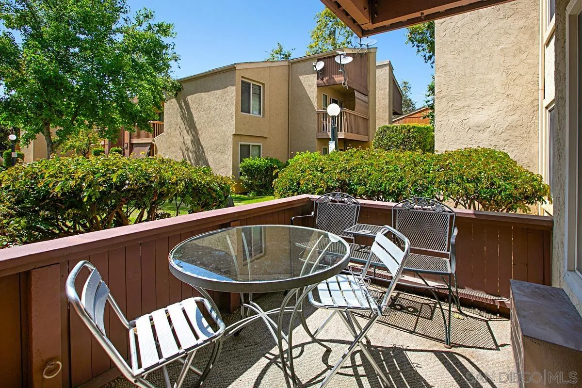 5906 Rancho Mission Road, Unit 5 San Diego, CA 92108 - Photo 19 of 33 a view of a patio with table and chairs and potted plants