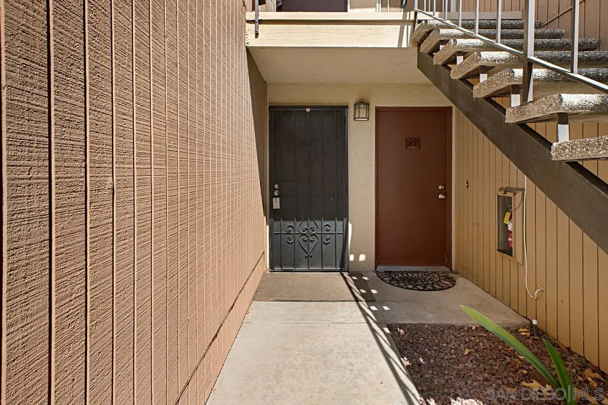 5906 Rancho Mission Road, Unit 5 San Diego, CA 92108 - Photo 2 of 33 a view of a door and wooden floor