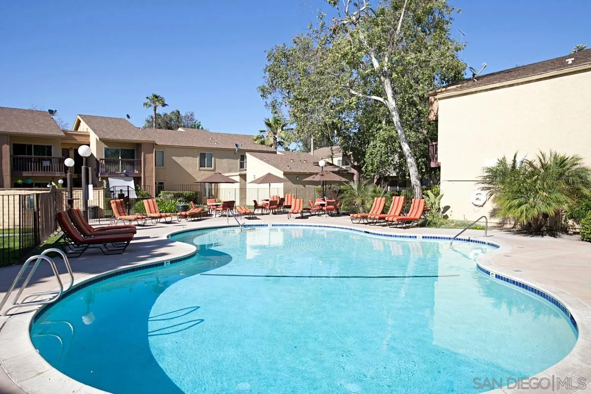 5906 Rancho Mission Road, Unit 5 San Diego, CA 92108 - Photo 26 of 33 a view of a swimming pool with outdoor seating
