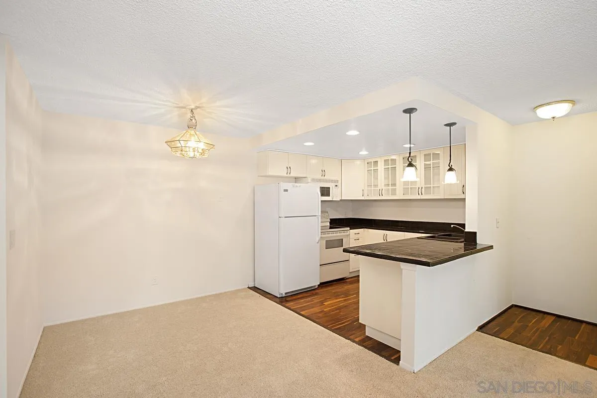 5906 Rancho Mission Road, Unit 5 San Diego, CA 92108 - Photo 10 of 33 a kitchen with a stove and a refrigerator