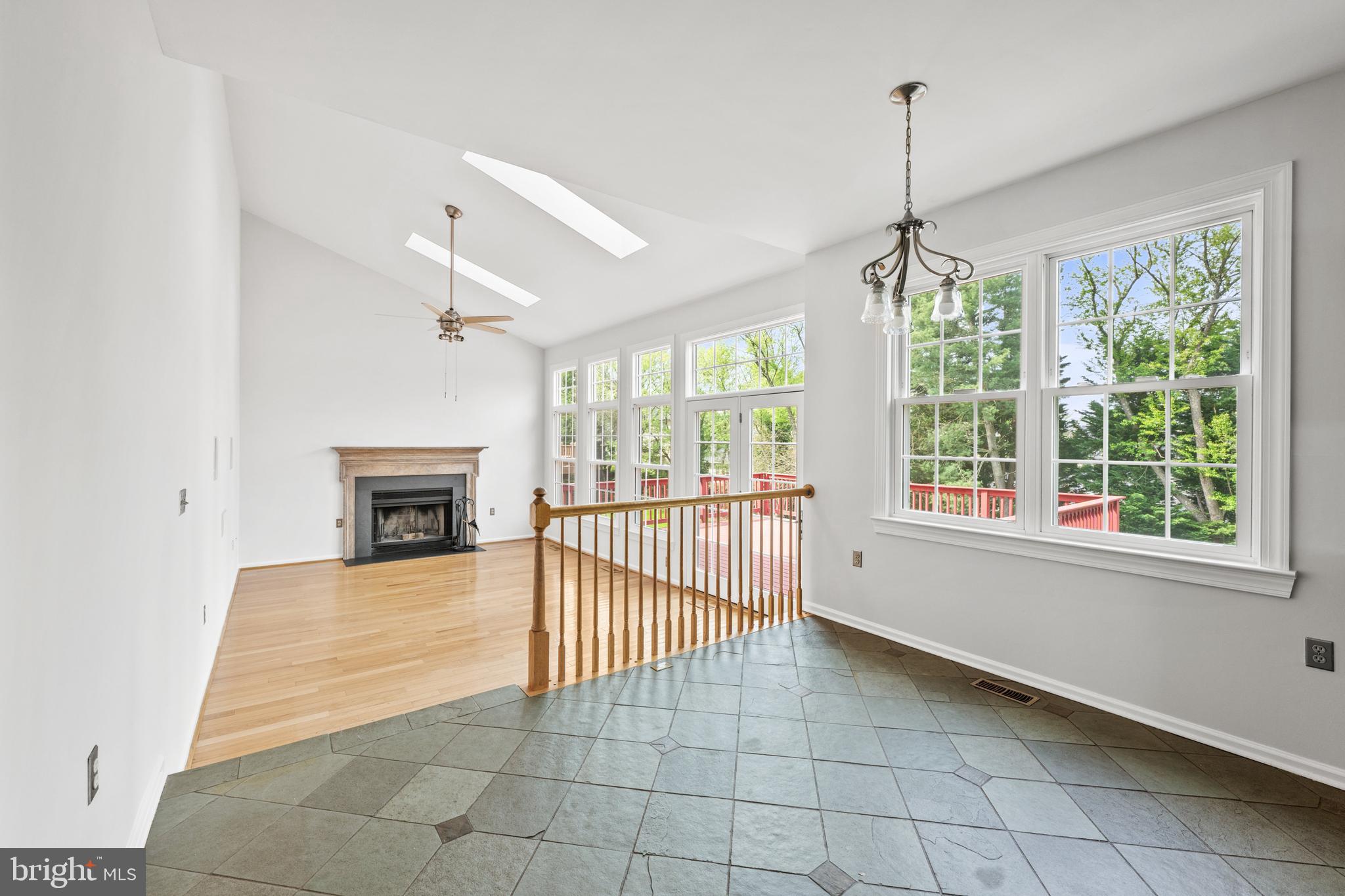 409 Midsummer Drive Gaithersburg, MD 20878 - Photo 12 of 41 a view of a livingroom with a ceiling fan window and a fireplace