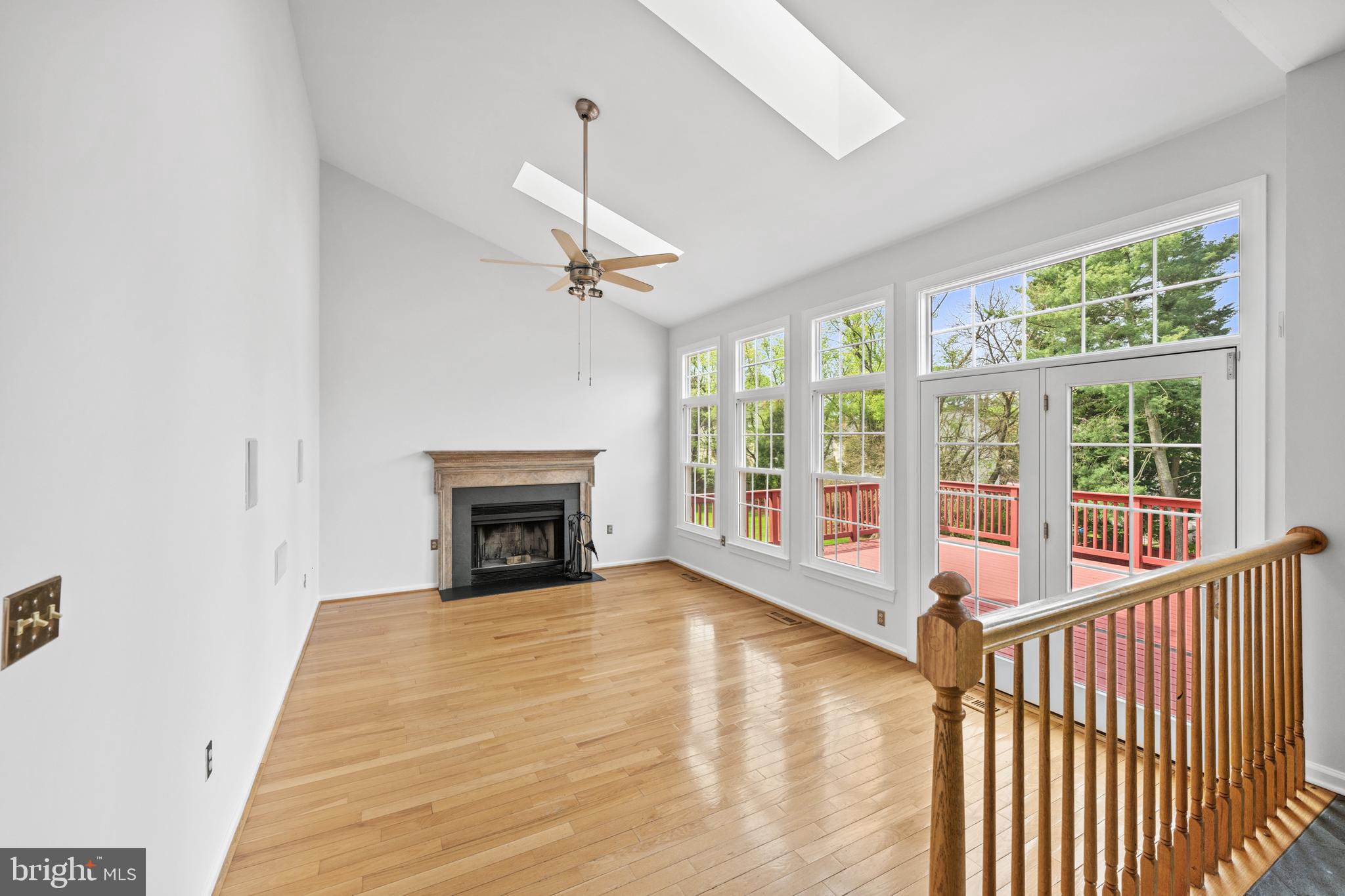 409 Midsummer Drive Gaithersburg, MD 20878 - Photo 13 of 41 a view of an empty room with a fireplace and a window