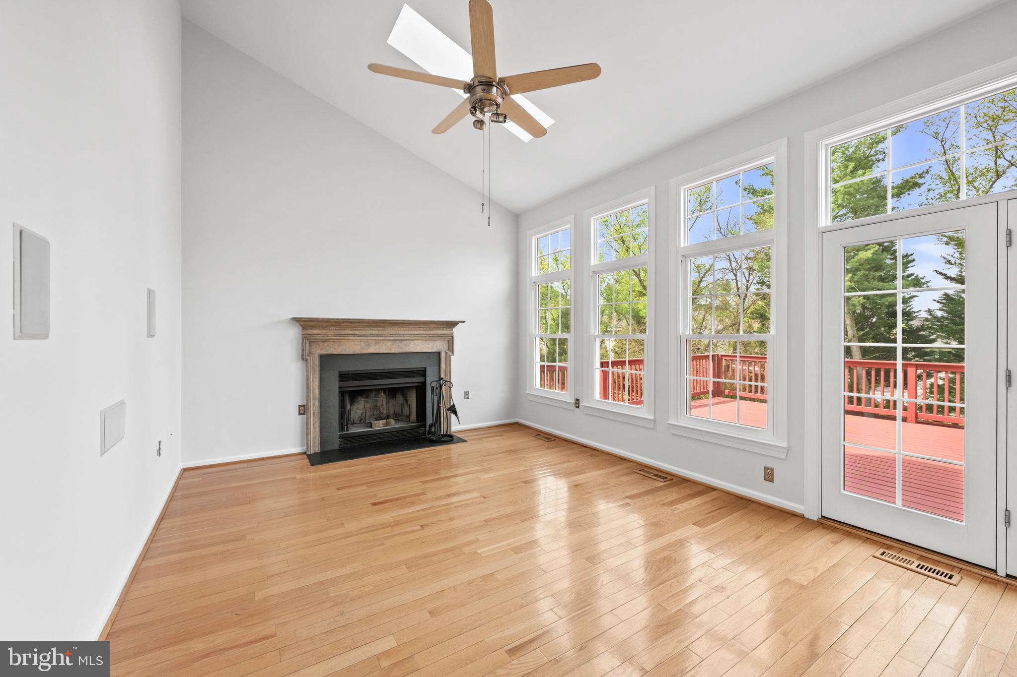409 Midsummer Drive Gaithersburg, MD 20878 - Photo 14 of 41 a view of an empty room with window and a fireplace