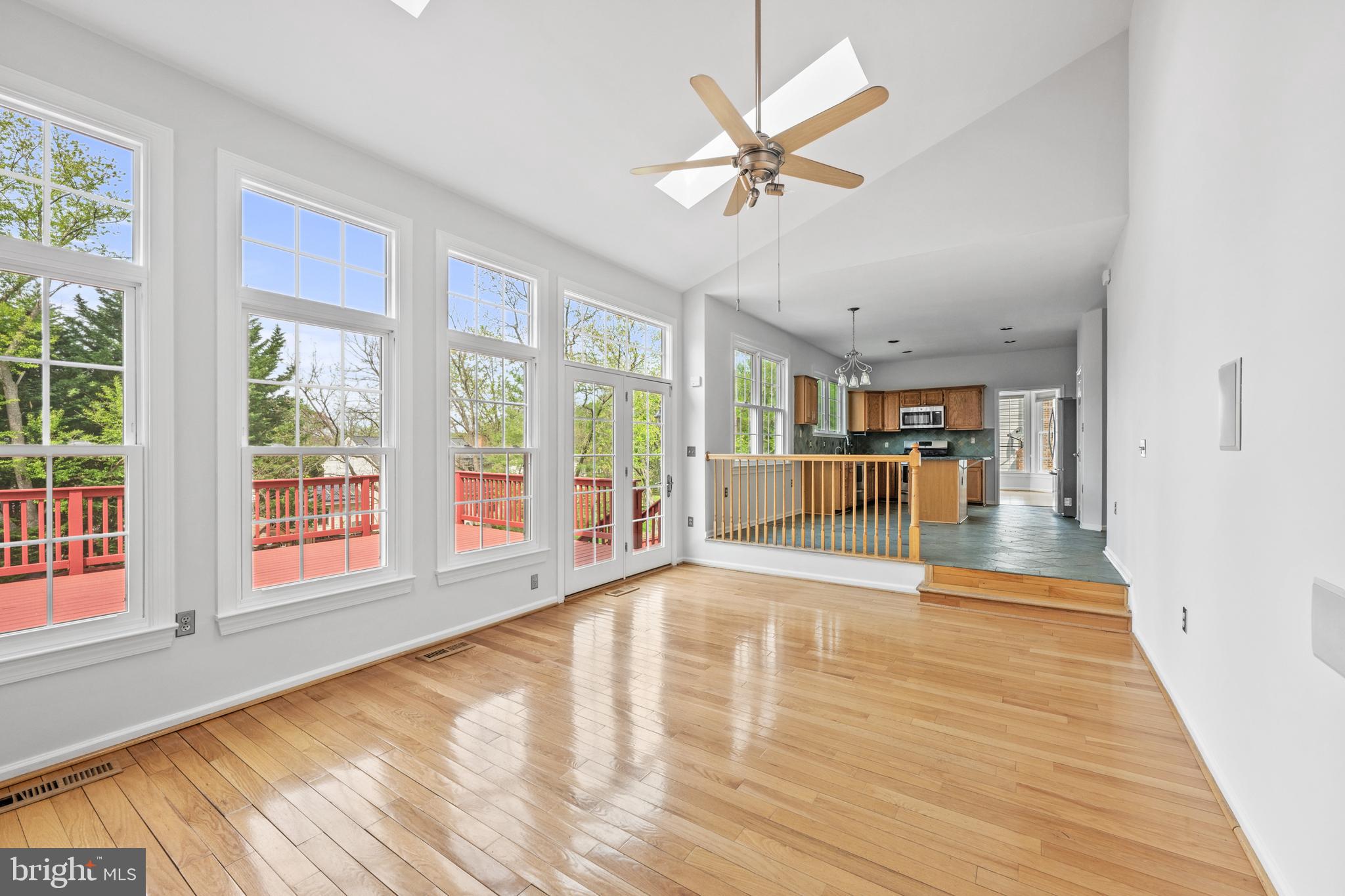 409 Midsummer Drive Gaithersburg, MD 20878 - Photo 15 of 41 a view of an empty room with wooden floor and a window