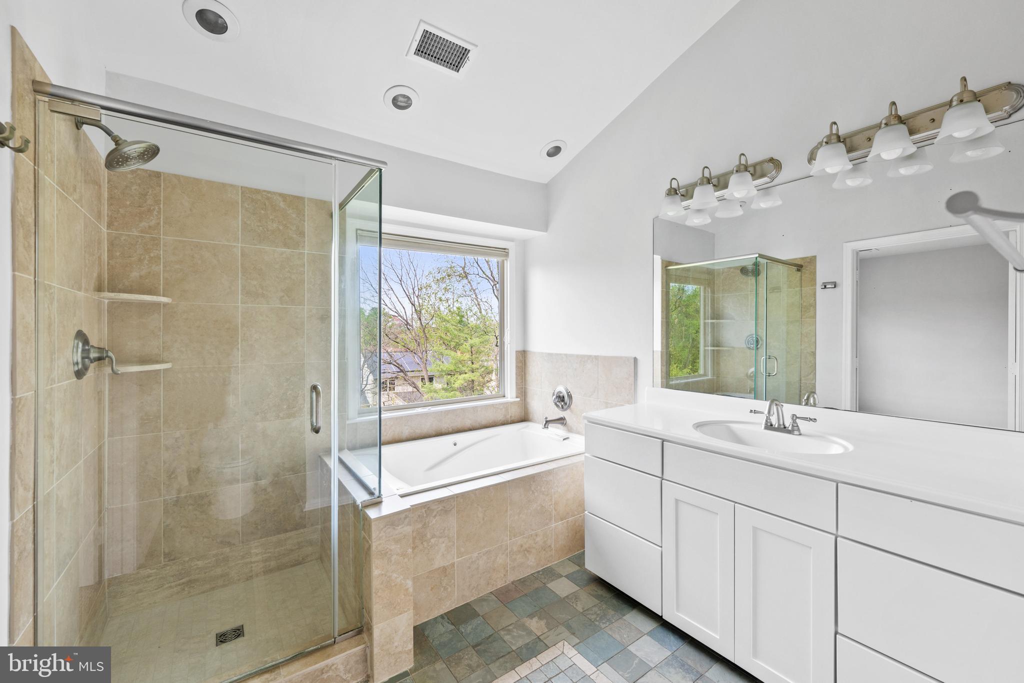 409 Midsummer Drive Gaithersburg, MD 20878 - Photo 26 of 41 a bathroom with a double vanity sink mirror and shower