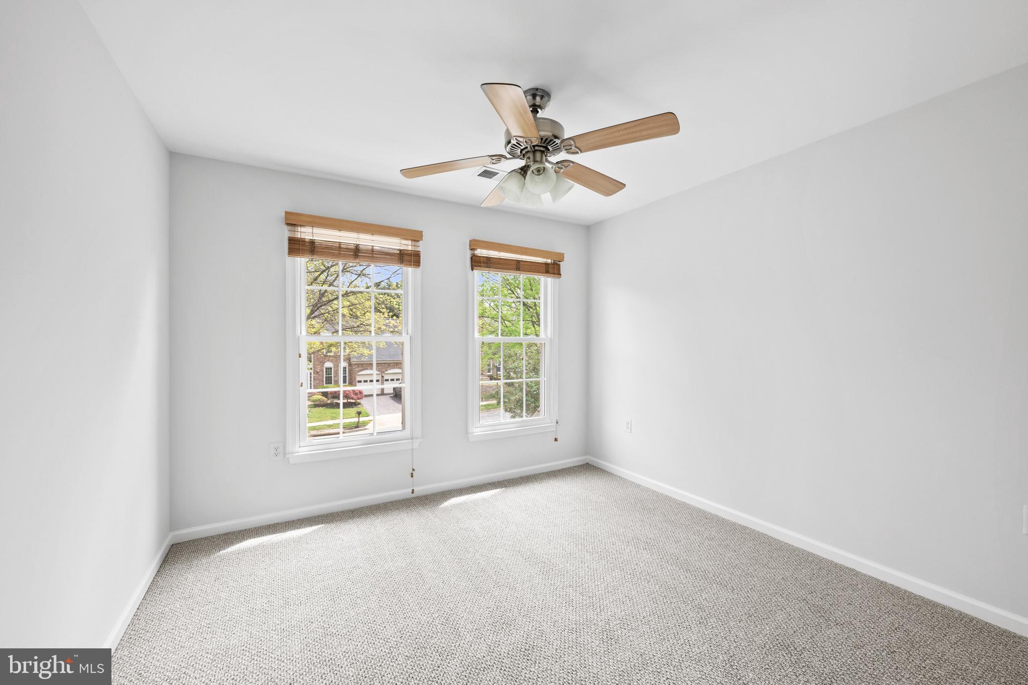 409 Midsummer Drive Gaithersburg, MD 20878 - Photo 27 of 41 an empty room with windows and fan