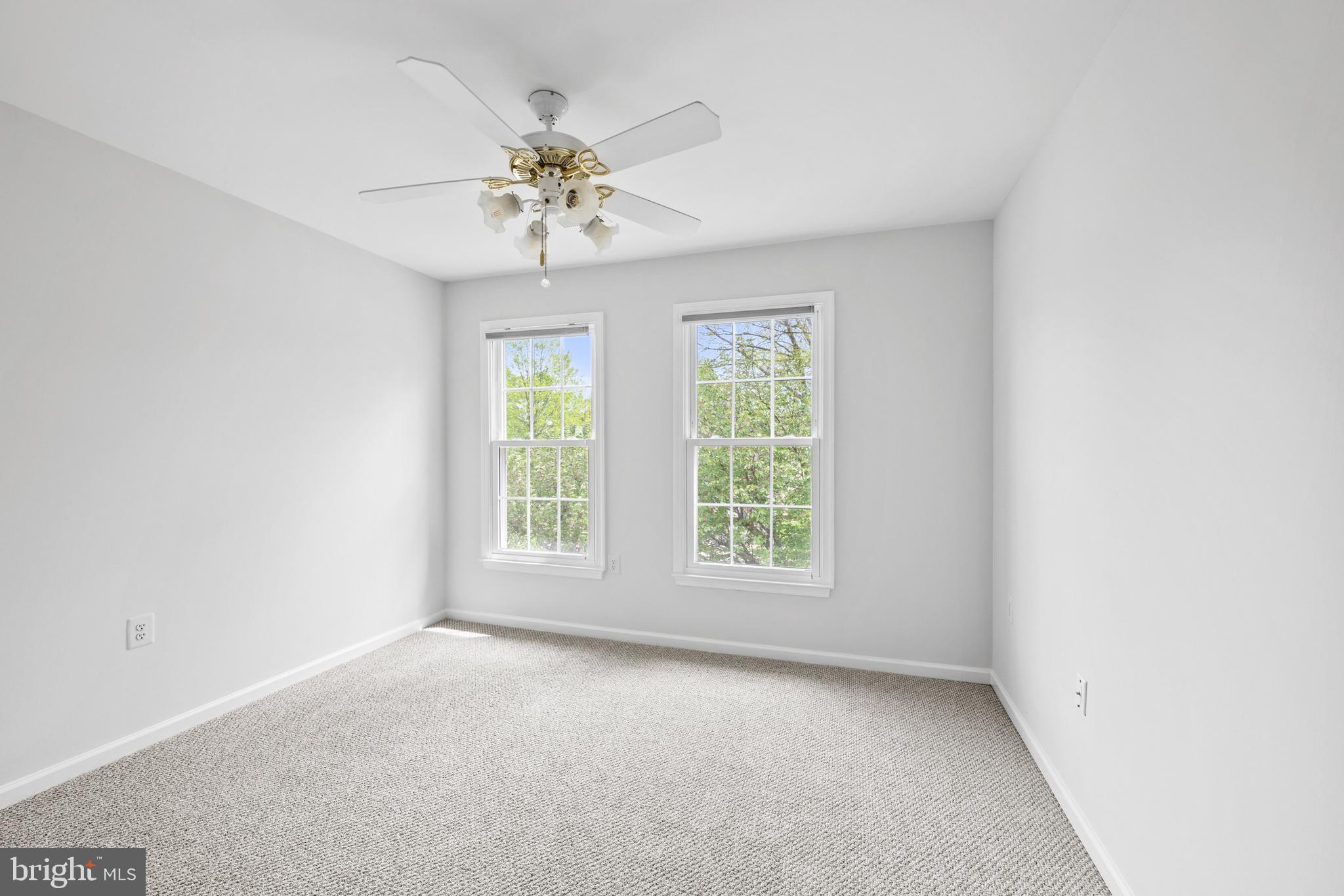 409 Midsummer Drive Gaithersburg, MD 20878 - Photo 28 of 41 an empty room with chandelier fan and window