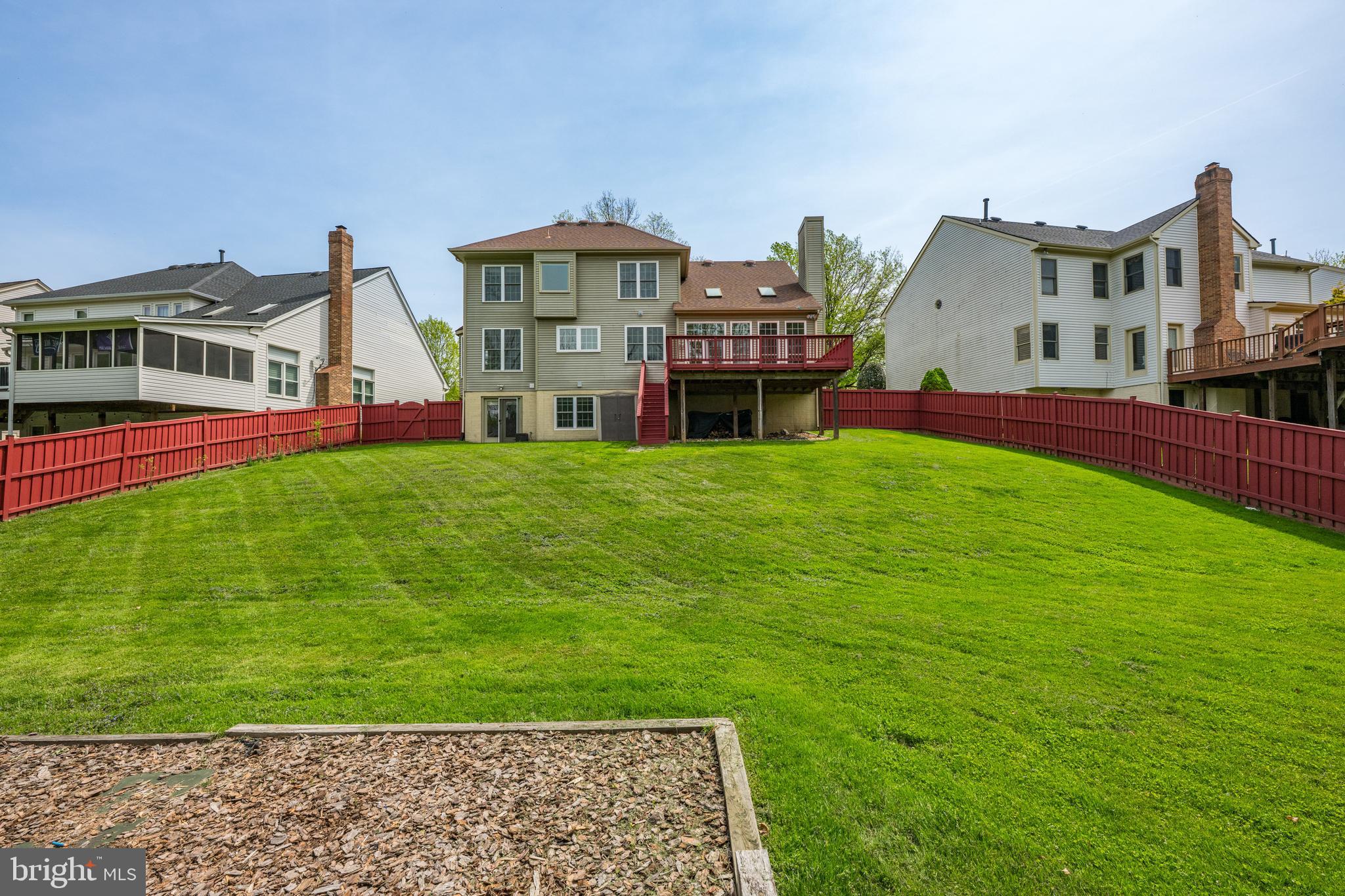 409 Midsummer Drive Gaithersburg, MD 20878 - Photo 39 of 41 a view of a house with a big yard and large trees