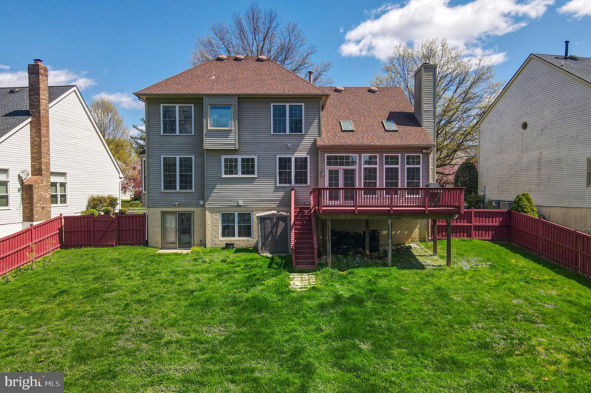 409 Midsummer Drive Gaithersburg, MD 20878 - Photo 40 of 41 a view of a house with a yard porch and sitting area