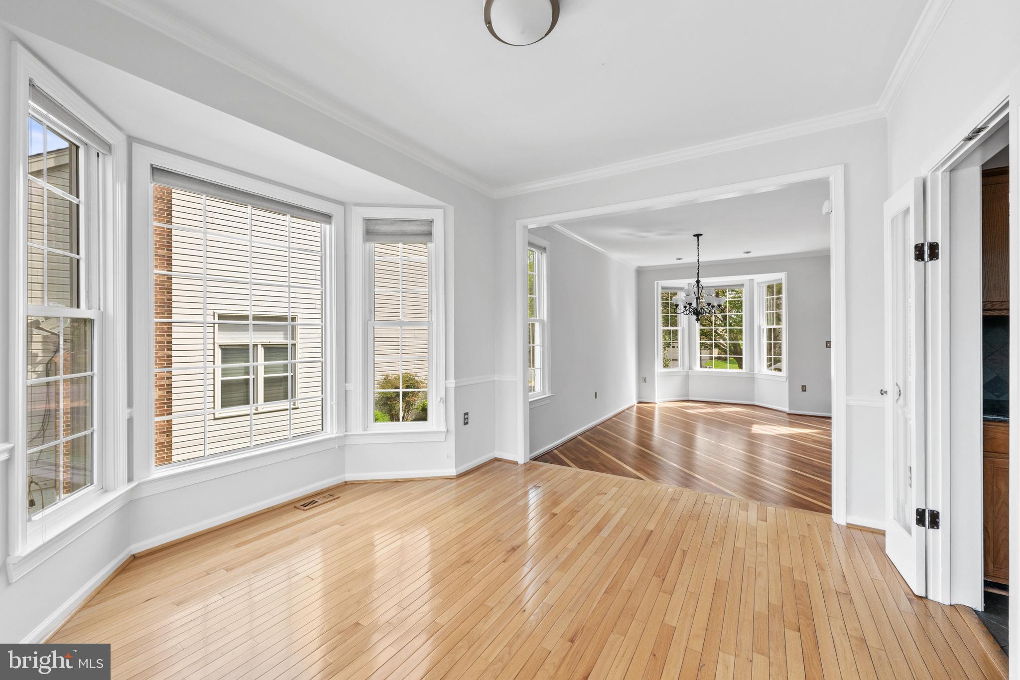 409 Midsummer Drive Gaithersburg, MD 20878 - Photo 7 of 41 a view of empty room with wooden floor and fan