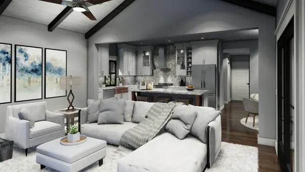 a living room with furniture and a chandelier