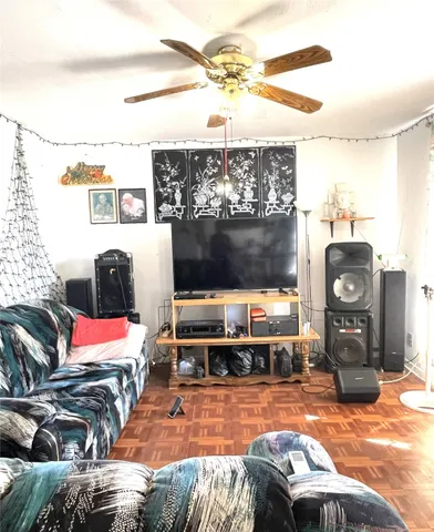 a living room with furniture a flat screen tv
