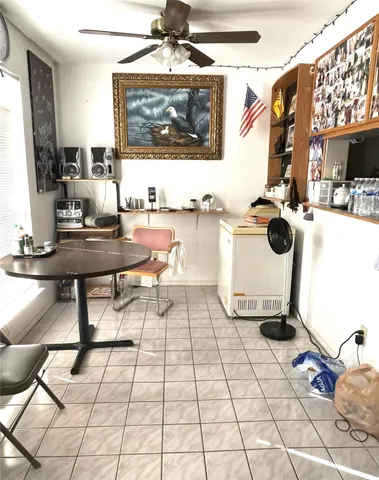 a living room with a couch and next to a window