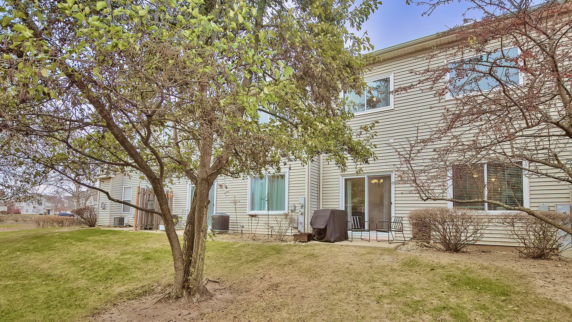 360 Tower Drive Hainesville, IL 60030 - Photo 20 of 22 a view of a house with a tree in the background