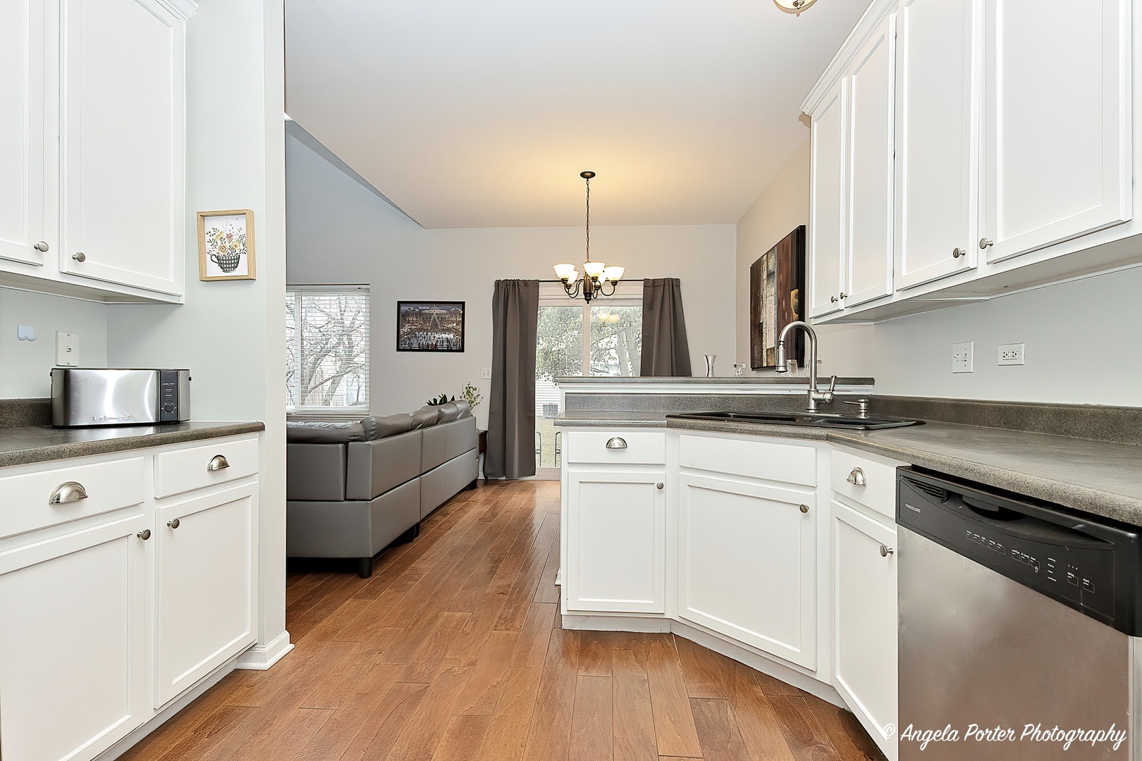 360 Tower Drive Hainesville, IL 60030 - Photo 5 of 22 a kitchen with granite countertop white cabinets and white appliances