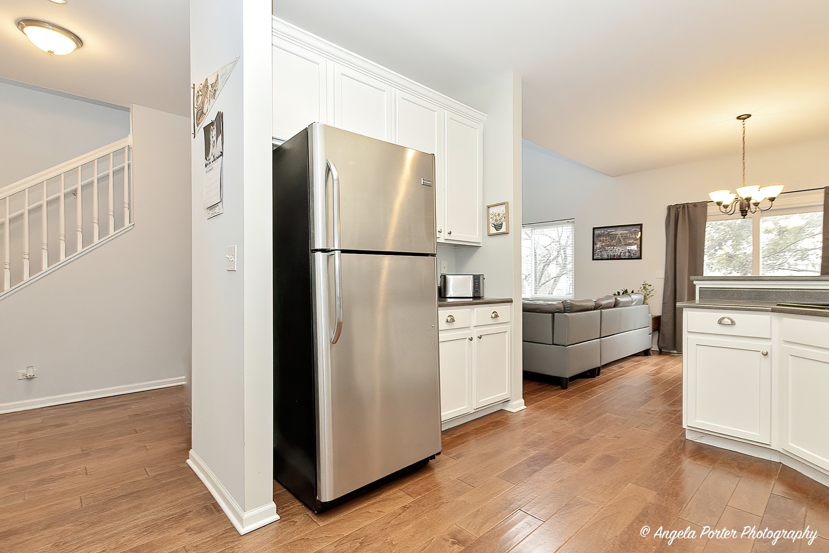 360 Tower Drive Hainesville, IL 60030 - Photo 7 of 22 a kitchen with sink a refrigerator and white cabinets