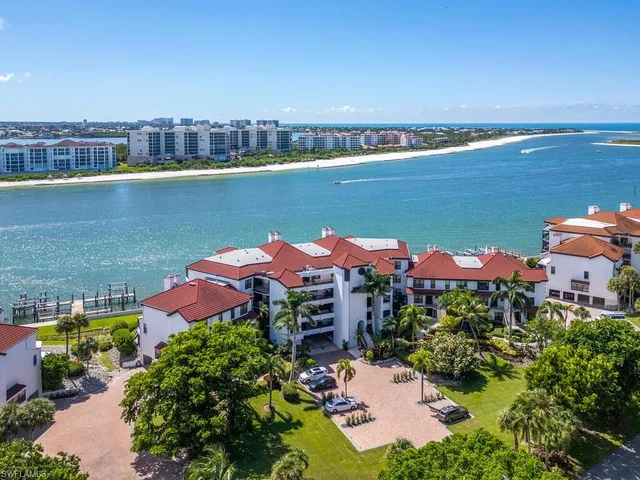 an aerial view of a house with a lake view