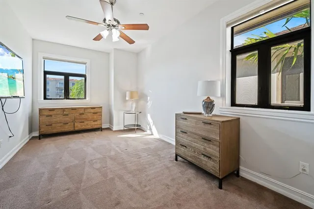 a view of room with furniture and windows