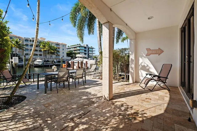 a view of a swimming pool with chairs