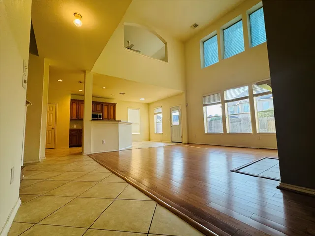 a view of an entryway door with wooden floor