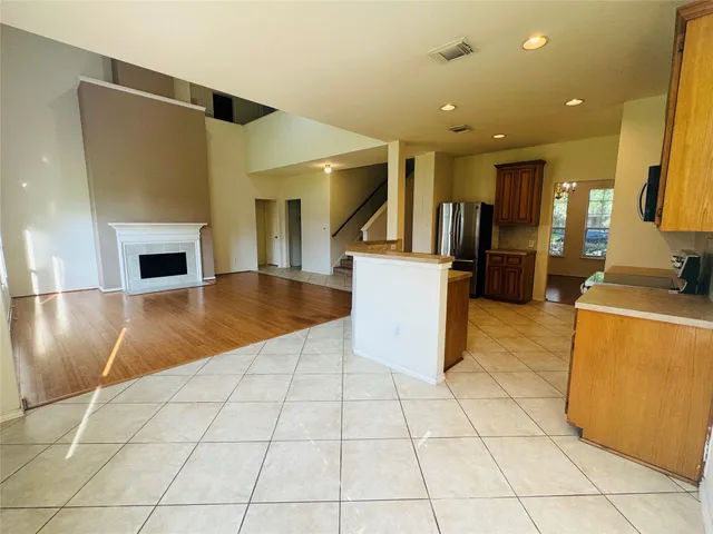 a view of a livingroom with kitchen and furniture