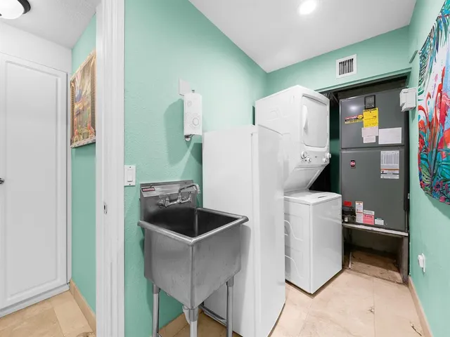 an aerial view of a house with a ocean view