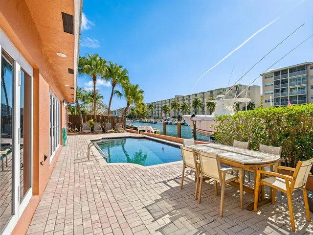 a view of a patio with swimming pool