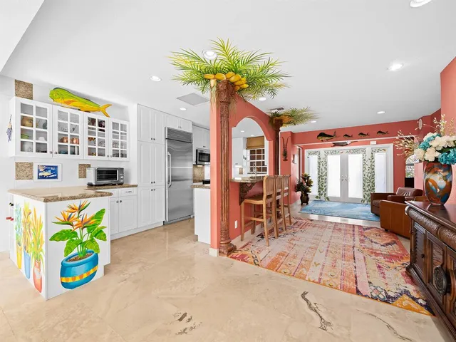 a kitchen with stainless steel appliances granite countertop a stove and a sink