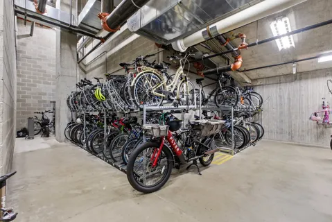 a view of a work space with furniture and window in a room