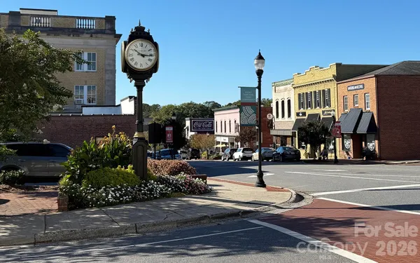 a view of a street with a bench