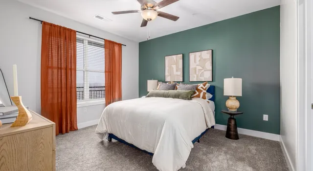 a bedroom with a bed and window