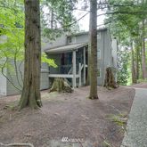 a view of house with a tree in front of it
