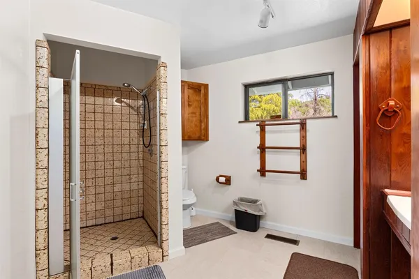 a living room with a bed furniture and a window
