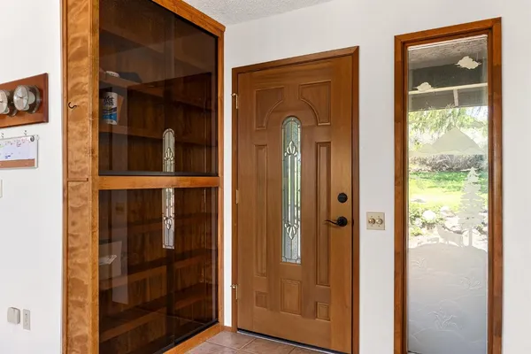a kitchen with stainless steel appliances granite countertop a sink and a refrigerator