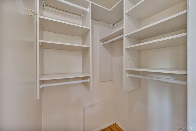 a view of an empty walk in closet