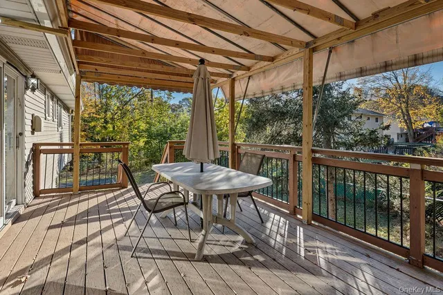 a view of a table and chairs on the roof deck