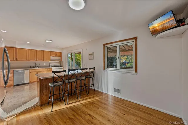 a view of a dining room with furniture and window