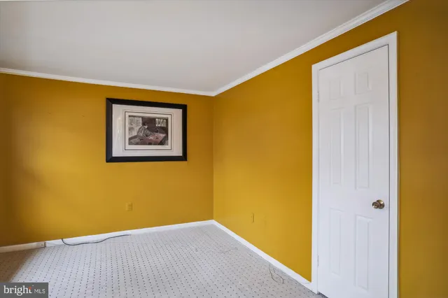 a view of a room with a wall and a window