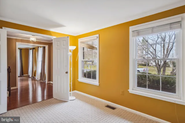 a view of a room with a large window
