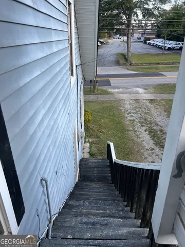 a view of balcony with wooden floor and lake view