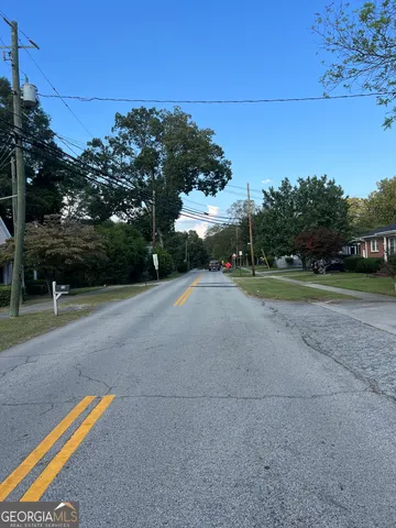 a view of a road with a yard