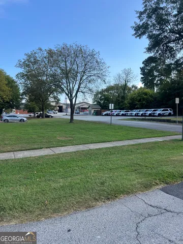 a view of a park with large trees
